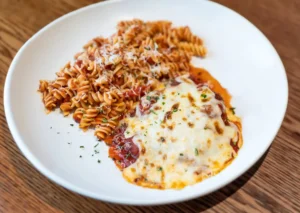 Assortment of delicious gluten-free dishes from a restaurant's menu, showcasing pasta